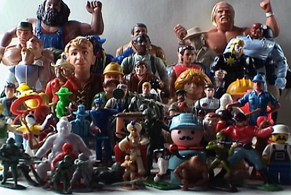 Man in Relation to Men, 2006, video still<br><br>Go to menu, click VIDEOS, to watch excerpts<br><br>Man in Relation to Men looks at masculinity using an array of male action figures from diverse eras.